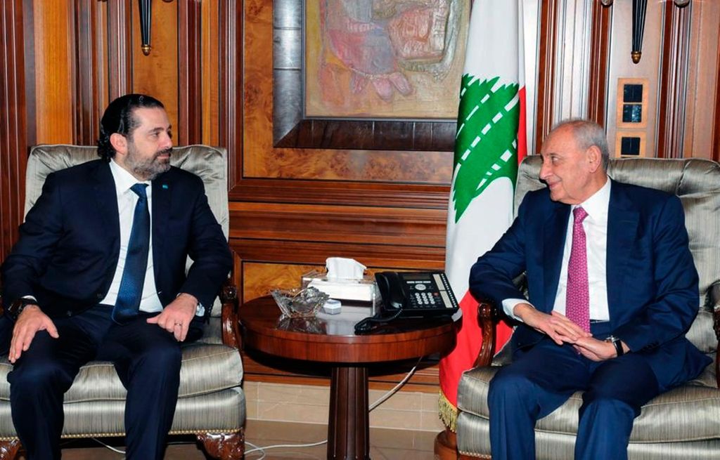 In this photo released by Lebanon's official government photographer Dalati Nohra, Parliament Speaker Nabih Berri, right, meets with outgoing Prime Minister Saad Hariri, in Beirut, Lebanon, Saturday, Dec. 21, 2019. Lebanon's newly designated prime minister says he plans to form a government of experts and independents to deal with the country's crippling economic crisis. Hassan Diab spoke to reporters Friday, following a meeting with former Prime Minister Saad Hariri, a day after he was asked by the president to form the country's next government. (Dalati Nohra via AP)