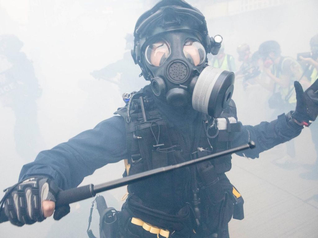 A member of the Hong Kong riot police during clashes in the Mong Kok area of Hong Kong. Rick Findler for The National