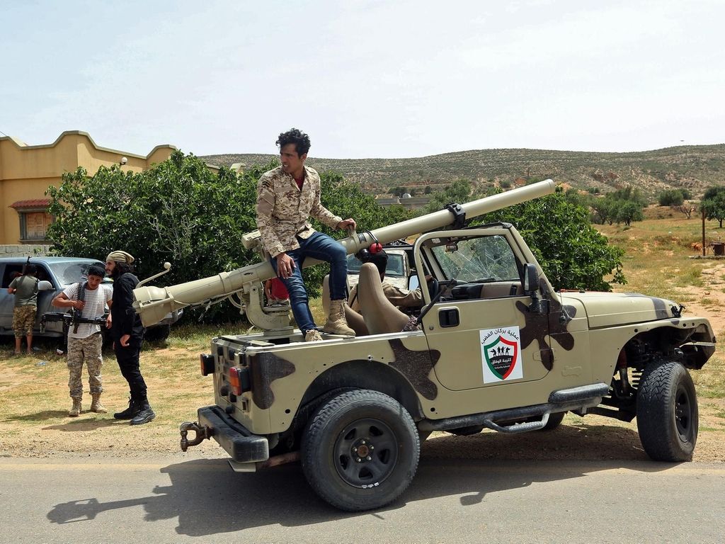 Fighters with Libya's Government of National Accord (GNA) gather at a position near the town of Garabulli, some 70 kms east of the capital Tripoli AFP
