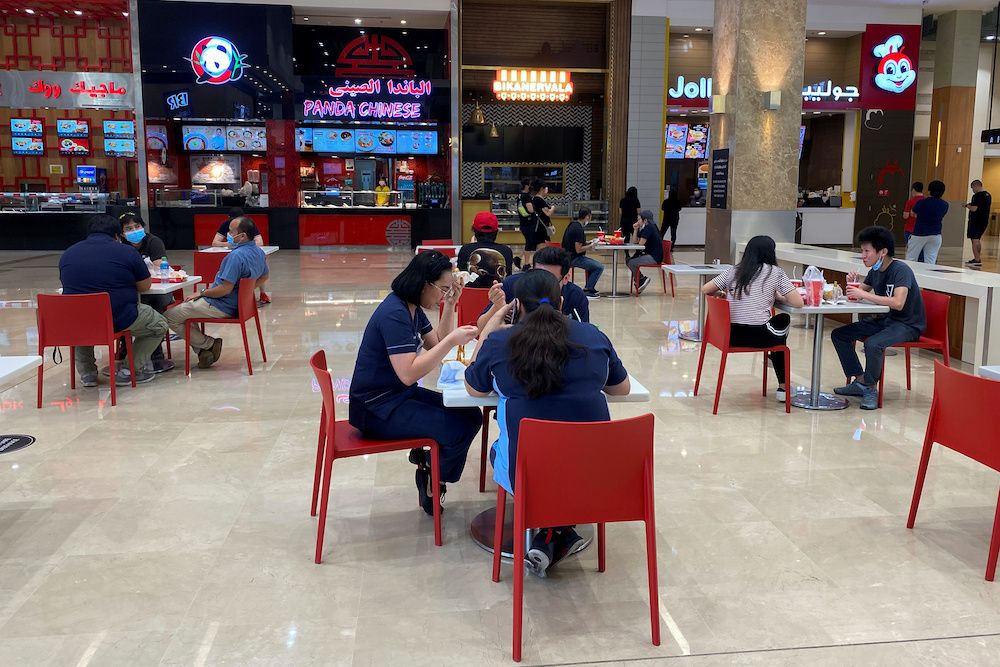 People eat in the food court at Dubai mall after the UAE government eased a curfew and allowed stores to open, following the outbreak of the coronavirus disease in Dubai, United Arab Emirates May 3, 2020. — Reuters pic