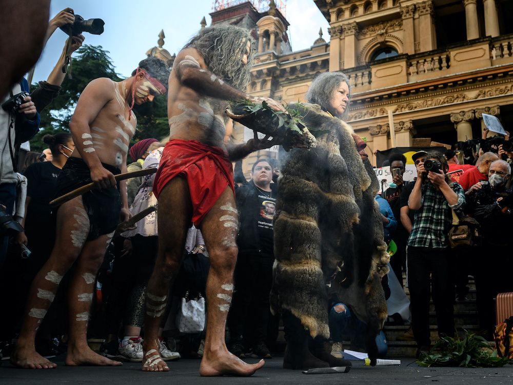 Aboriginal elders participate in a traditional smoke ceremony in front of the Sydney Town Hall during the Black Lives Matter rally in Sydney, Australia June 6, 2020. — Reuters pic