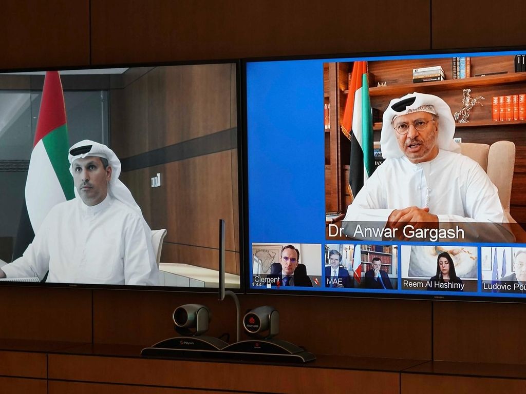 Khaldoon Al Mubarak attends a virtual meeting with Dr Anwar Gargash, Minister of State for Foreign Affairs, for the 12th annual UAE-France Strategic Dialogue. Courtesy Executive Affairs Authority