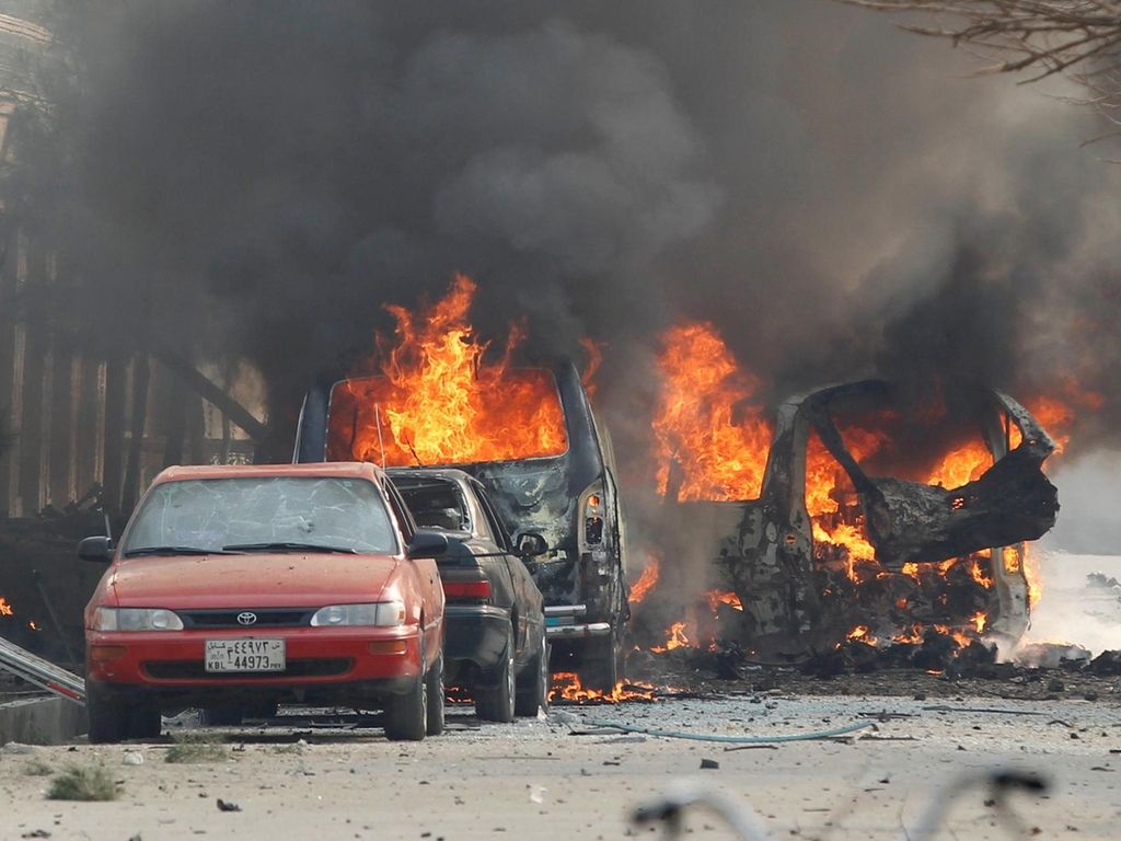 Vehicles are seen on fire after a blast in Jalalabad, Afghanistan January 24, 2018.REUTERS