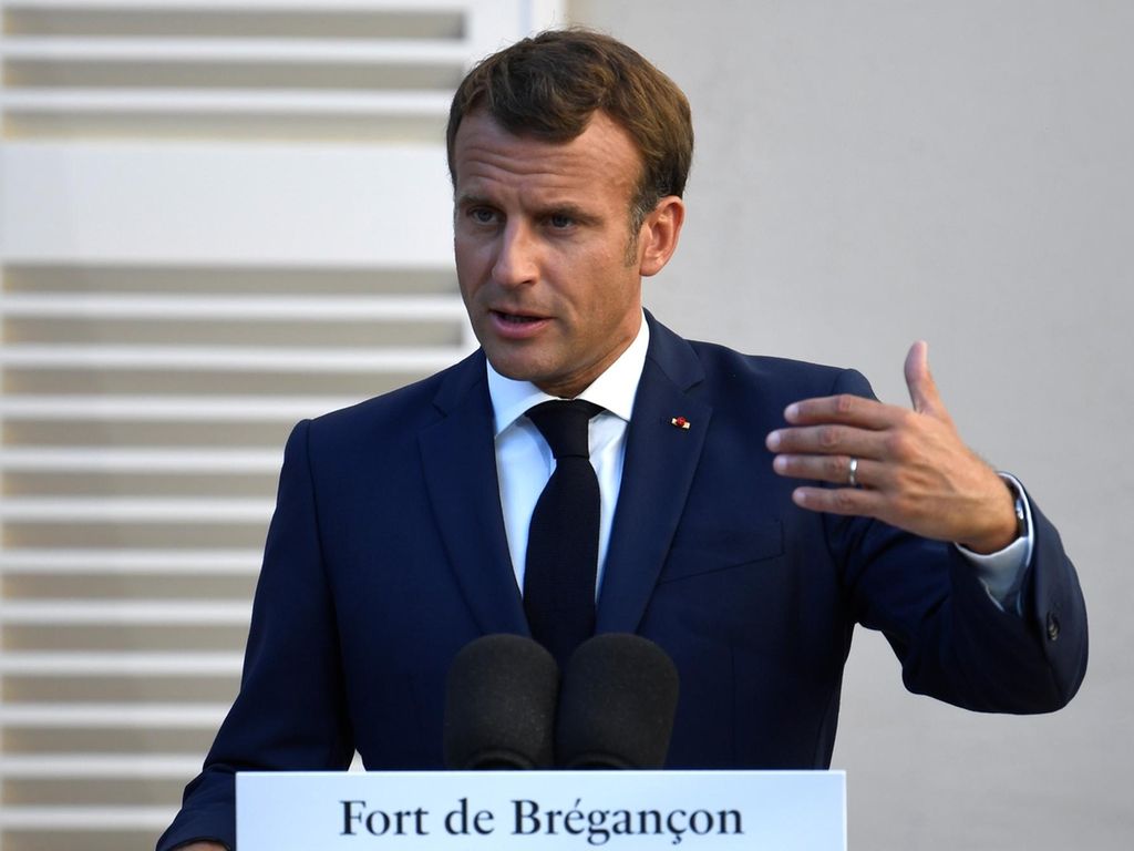 French President Emmanuel Macron speaks at the press conference after a meeting with German Chancellor Angela Merkel at Fort de Bregancon, in Bormes-les-Mimosas, France, on August 20, 2020 Reuters