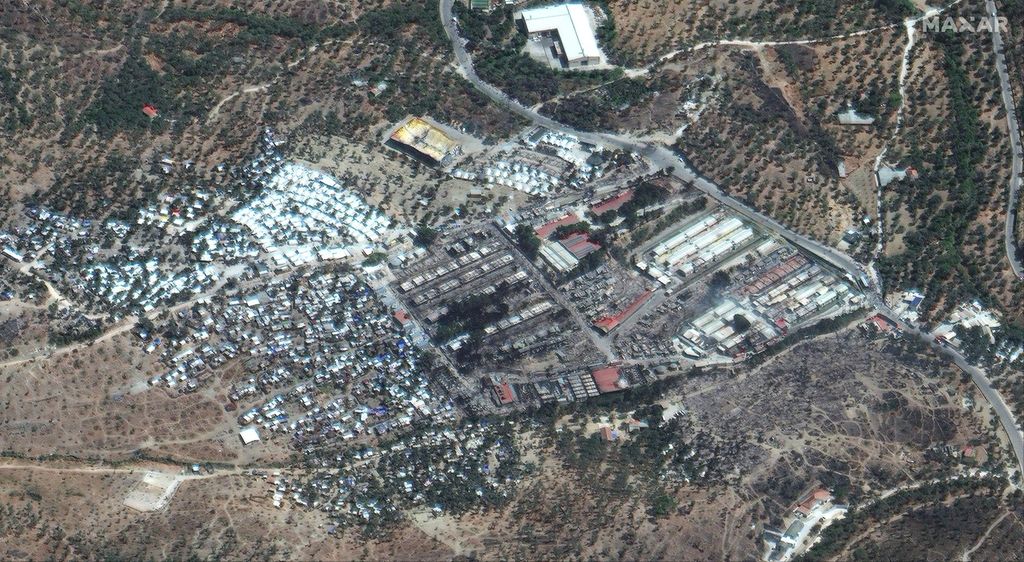 The carcus of Moria refugee camp, as it keeps on bursting into flames. EPA