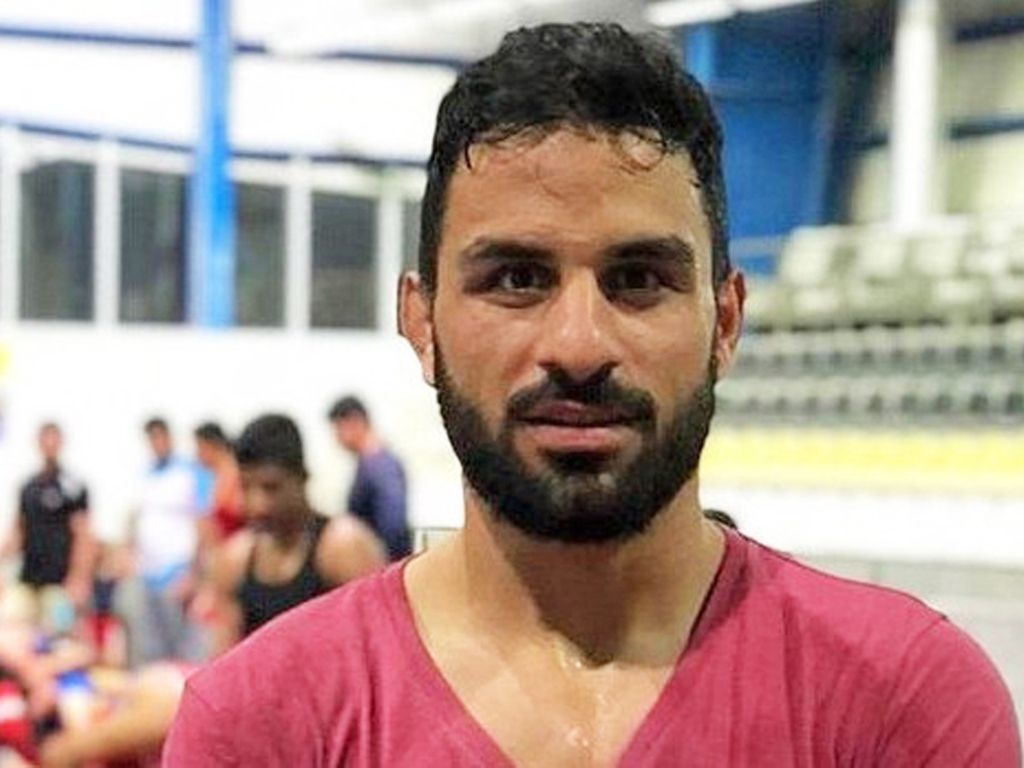 A undated handout photo made available 12 September 2020 by National Council of Resistance Iran (NWRI) and the Iranian Exile Society, showing Iranian champion wrestler Navid Afkari at a undisclosed location EPA