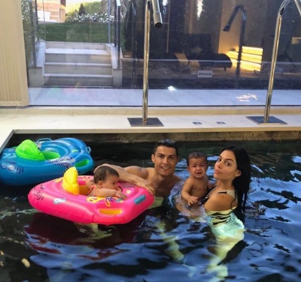 Ronaldo in the Madrid Palace pool with his family