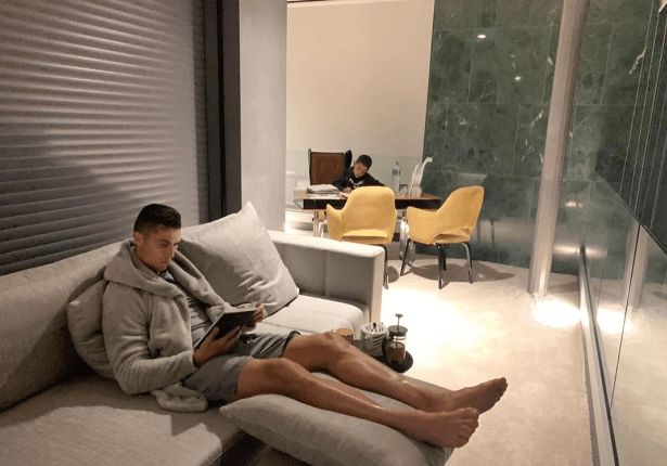Ronaldo reads with his son on his desk in Turin Palace