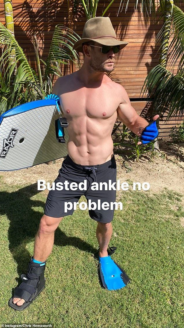 Absolutely torn! Chris also shared a photo of himself showing off his washboard abs with a boogie board in hand. In the picture he is rocking a boot on his right foot and a flipper on his left foot