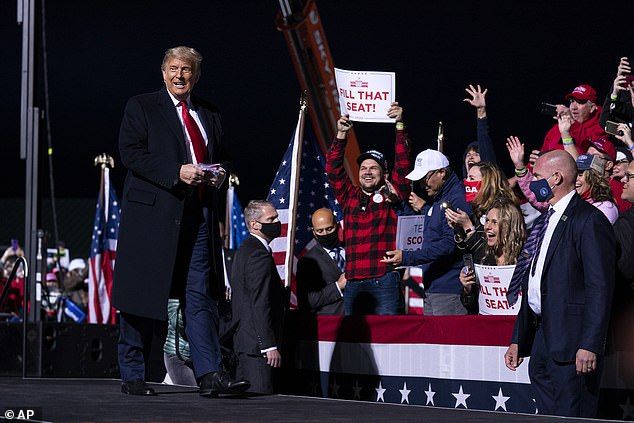 Trump told a rally in Florida on Monday that Biden forgot the name of Republican Mitt Romney on Monday. He is pictured at a crowded election rally at John Murtha Johnstown-Cambria County Airport on Tuesday