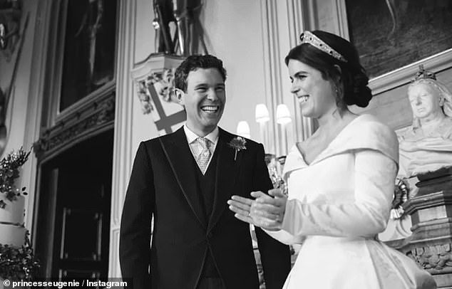 Meanwhile, in a third picture, the newlyweds seem to be beaming and laughing together, while on the left of the picture is a glimpse of their wedding cake