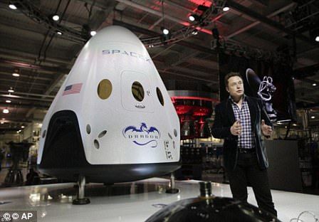 Elon Musk with his Dragon Crew capsule