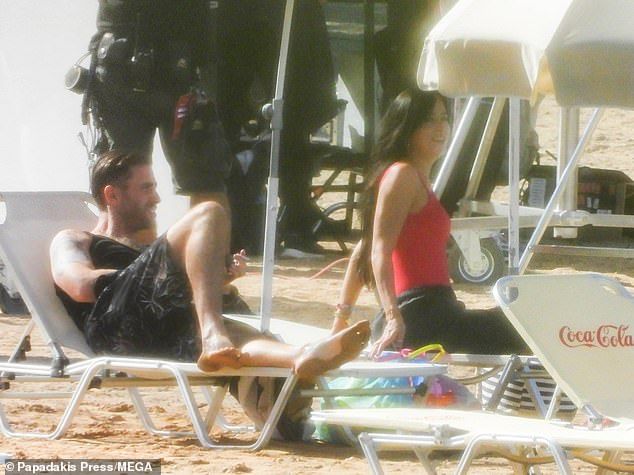 Chilled: Oliver, 33, looked just as reserved as he donned a black sleeveless top and dark shorts