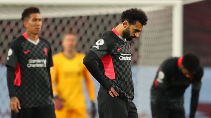 Mohamed Salah and his Liverpool team-mates react after Villa scores her fifth goal