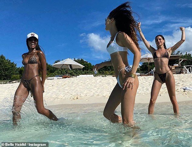 Splish Splash: She was splashing around in the water with friends while wearing a white bikini