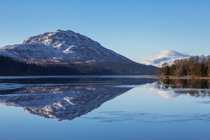 Loch Laggan and snow capped mountain Creag Meagaidh near Dalwhinnie in the Scottish Highlands in winter, Lochaber, Highlands, Scotland, UK Photo by Arterrauniversal Pictures group via getty pictures