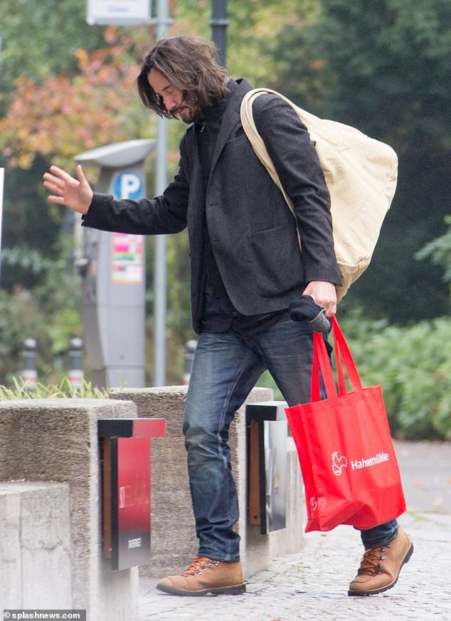 Farewell: Keanu was seen waving goodbye to Alexandra when she drove off and he entered his hotel