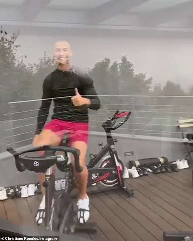 All good: He was filmed from the outside, on the bike, smiling and peddling, seemingly nonplussed to be stuck indoors