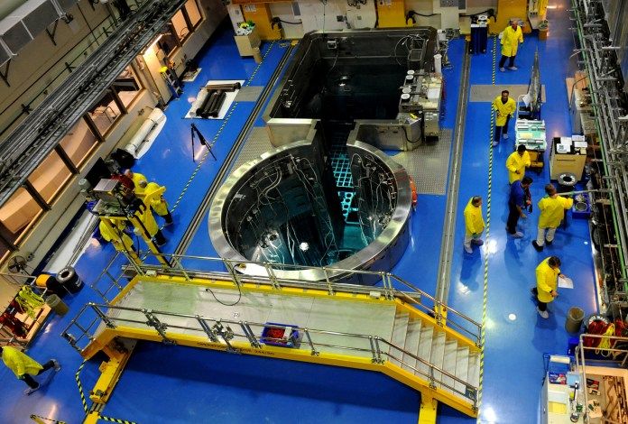 A nuclear reactor with people in protective clothing