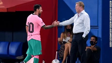Messi shakes hands with Barca coach Ronald Koeman after being substituted off during the friendly match between FC Barcelona and Girona at Estadi Johan Cruyff on September 16, 2020.