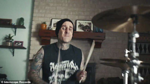 Determine the beat: Travis Barker is drumming heavily in the background