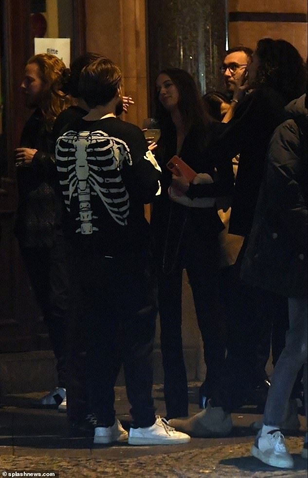 Going Out: The group looked in a good mood as they prepared to head home after their evening with Nicole enjoying a cigarette