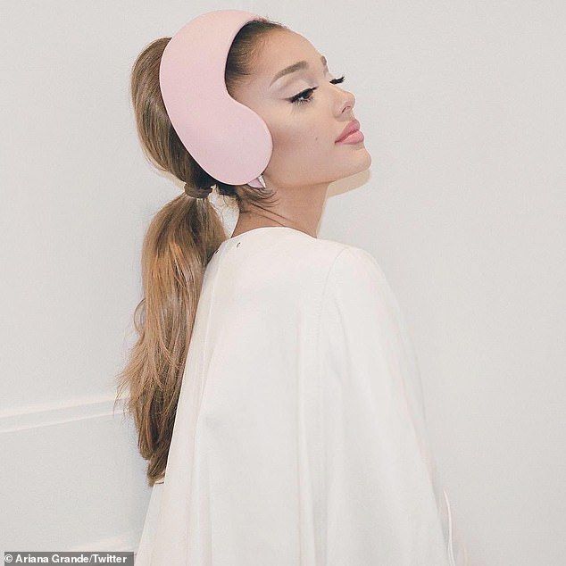 I'm with her: she also served mountain bunny chic in a white poncho and pink earmuffs and titled the look on Instagram: 'Ari2020'