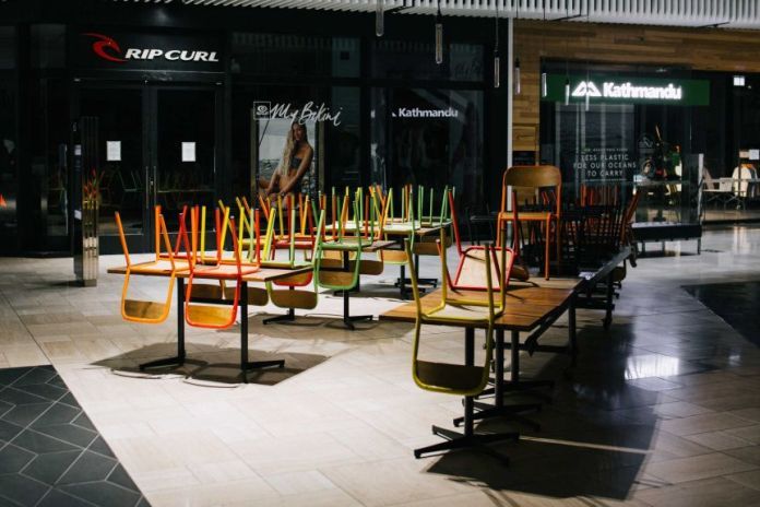 A photo of chairs on top of tables in a Melbourne mall restaurant.