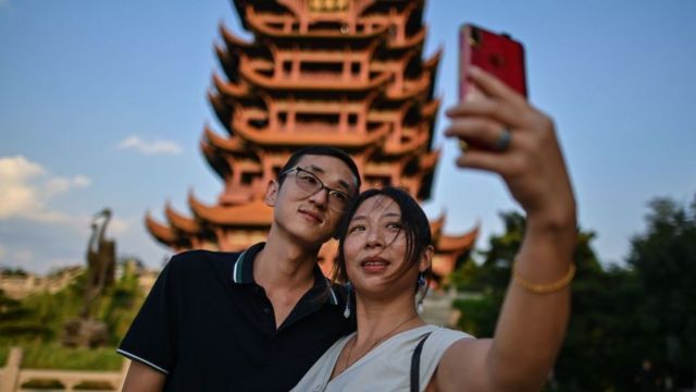Couple doing selfie with tower