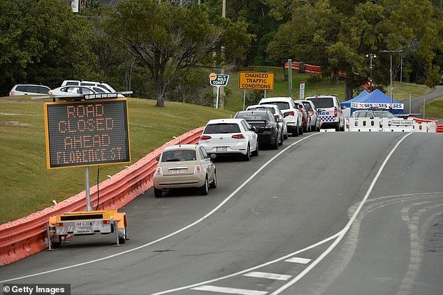 Ms. Palaszczuk is reportedly awaiting advice from the state's chief health officer and is likely to just extend the Sunshine State's border bubble with northern New South Wales (Image: Cars on the Queensland-New South Wales border in Coolangatta)