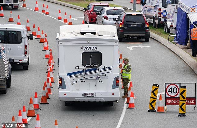 Motorists are stopped at a checkpoint in Coolangatta, on the Queensland-New South Wales border, when it was reintroduced in August