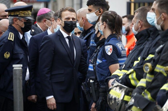 Emmanuel Macron visits the site of the attack in Nice