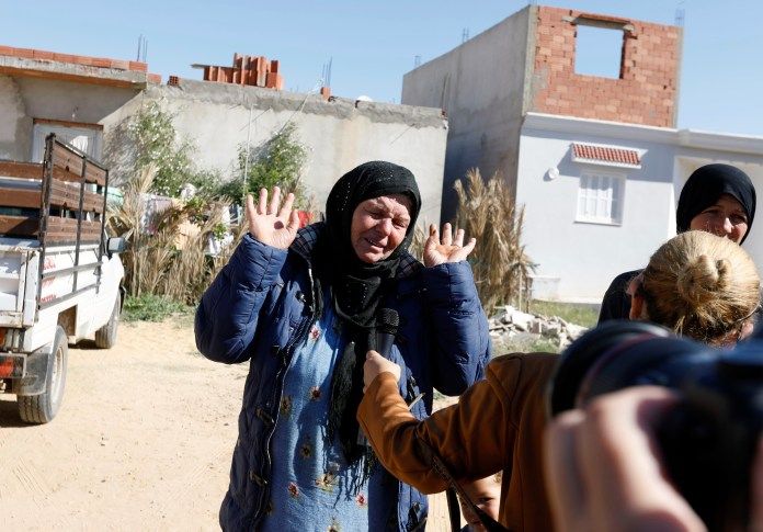 Reporters speak to the suspect's family in Tunisia
