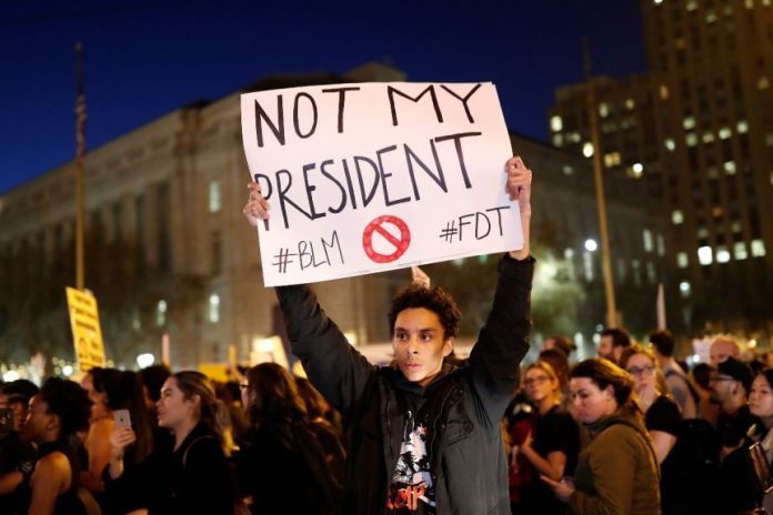 Person protests at the 2016 Trump rally