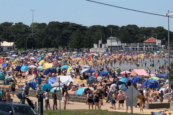 Williamstown Beach is crowded on a sunny day.