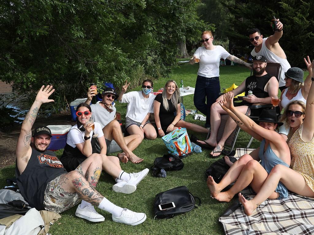 People gather in Footscray Park across from Flemington Racecourse.