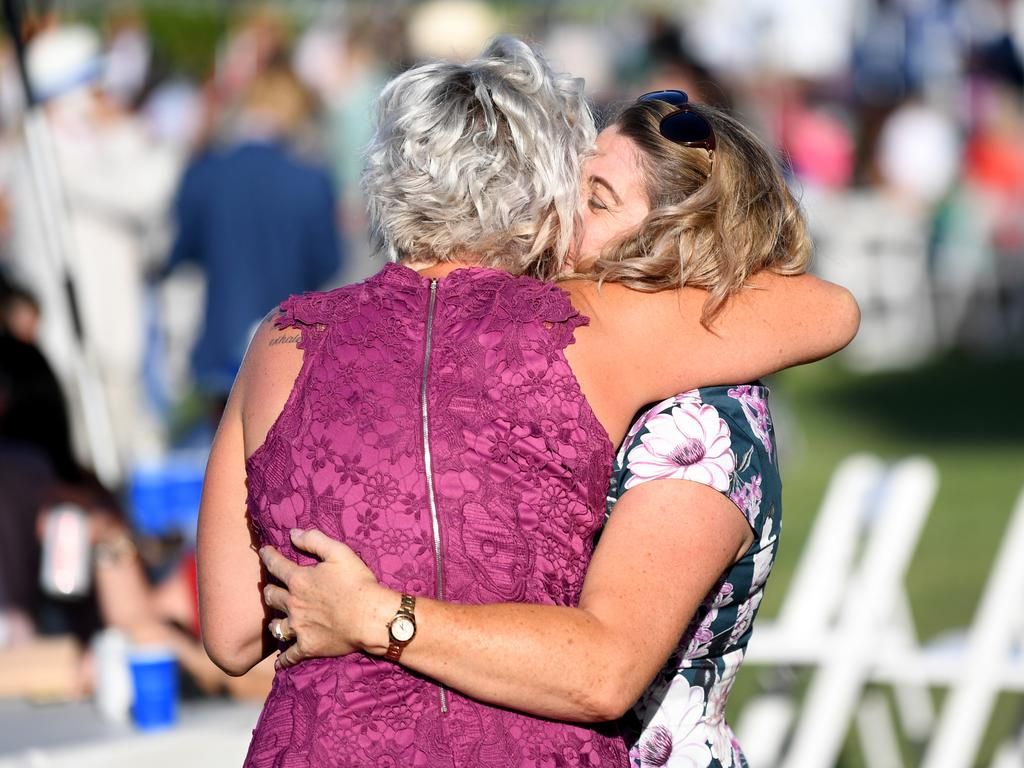 Race goers enjoy Melbourne Cup racing day at Doomben Racecourse.