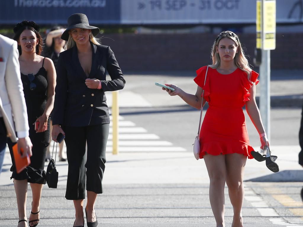 Race goers leave Royal Randwick after the Melbourne Cup race.