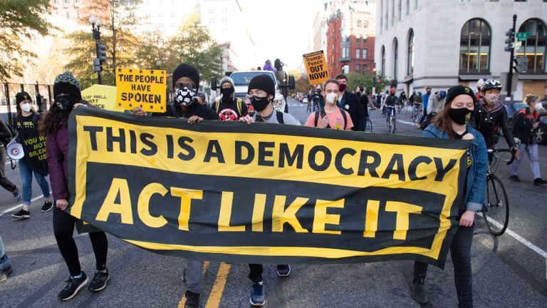 Protesters with ShutDown DC protest in Washington, DC on November 5, 2020 to promote the counting of all votes. (Photo by SAUL LOEB / AFP) (Photo by SAUL LOEB / AFP via Getty Images)