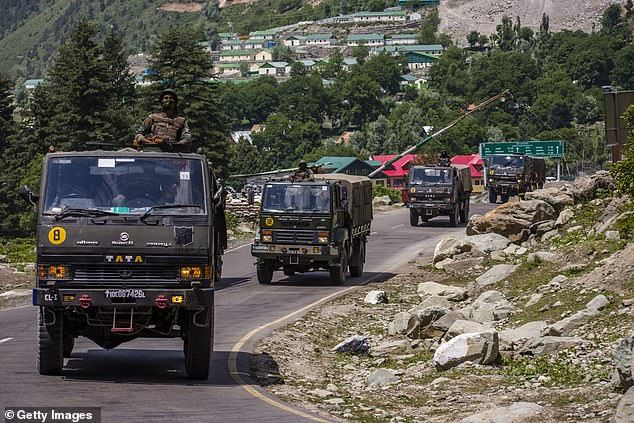 Indian army convoy rolls along highway bordering China in June following deadly confrontation at long-contested border