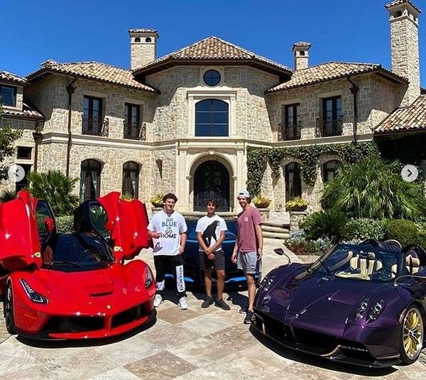 Teenage youtuber Gage Gillean with friends amid the cars in his collection (Photo: Instagram)
