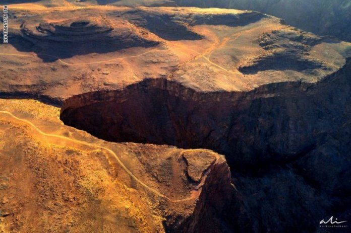 Stand on the edge .. a majestic scene of a deep rift that split into Saudi Arabia thousands of years ago