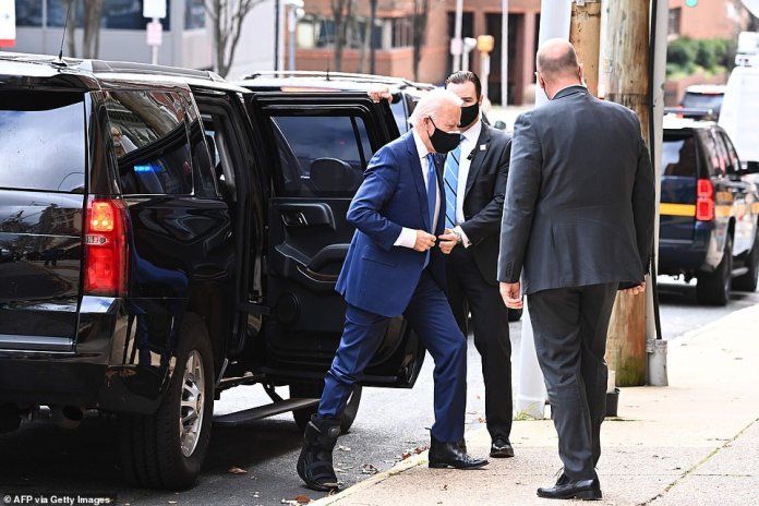 Effort: Joe Biden steps forward on the sidewalk as he prepares for his economics speech