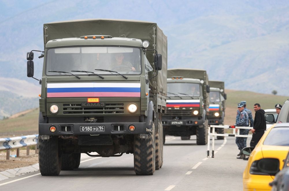 Vehicles of Russian peacekeepers leaving Azerbaijan’s Nagorno-Karabakh region for Armenia pass an Armenian checkpoint on a road near the village of Kornidzor, Armenia September 22, 2023. — Reuters pic