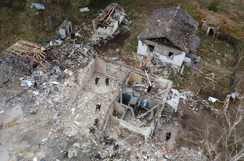 Rescues remove debris at a site of buildings of a local cafe and a grocery store, where at least 52 people were killed by a Russian missile strike, amid Russia's attack on Ukraine, in the village of Hroza, in Kharkiv region, Ukraine October 6, 2023. — Reuters pic