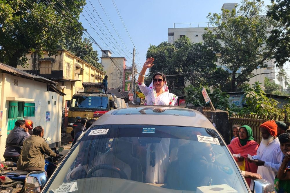 In this photograph taken on January 4, 2024, transgender candidate Anwara Islam Rani waves to supporters as she parades along a street during a campaign event in Rangpur, ahead of Bangladesh’s general election on January 7. ― AFP pic