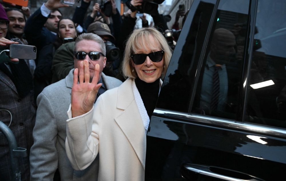 Writer E. Jean Carroll waves as she leaves federal court after the verdict in her defamation case against former US president Donald Trump in New York January 26, 2024. — AFP pic