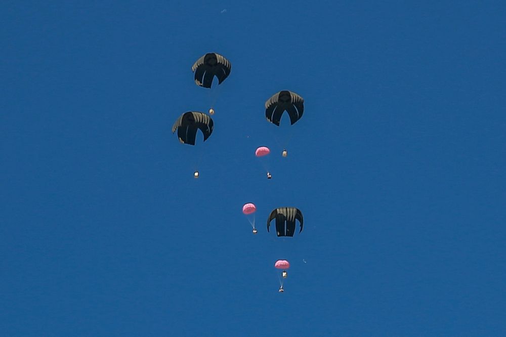 Pink aid parcels, reportedly to mark International Women’s Day, are airdropped over the northern Gaza Strip on March 8, 2024, amid the ongoing conflict between Israel and the Hamas movement. — AFP pic