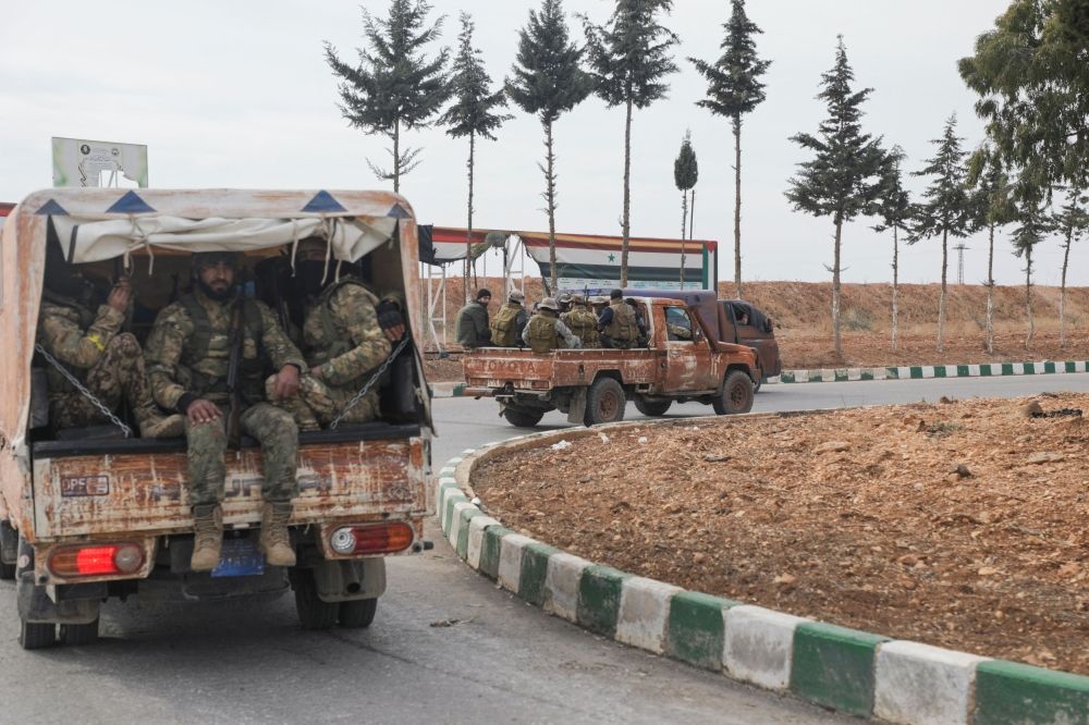 Rebel fighters in Homs. — Reuters pic