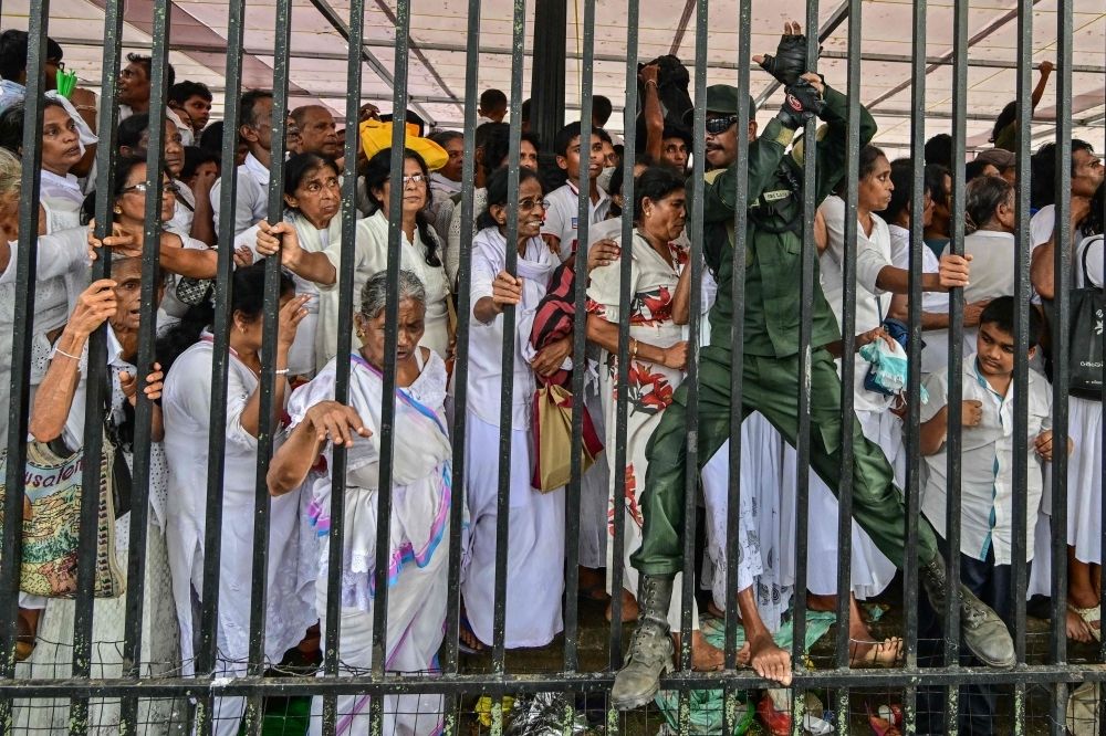 ‘Serious security lapse’: Sri Lanka police investigate alleged breach over Buddha tooth relic photo circulating on social media A military official (right) tries to help devotees avoid chaos during a gathering for a public exposition of the sacred Tooth relic of the Buddha at the Temple of the Tooth in Kandy April 18, 2025. Tens of thousands of pilgrims thronged Sri Lanka's holy city of Kandy on April 18 at the start of a rare display of a prized Buddhist relic, triggering traffic chaos and public protests. — AFP pic
